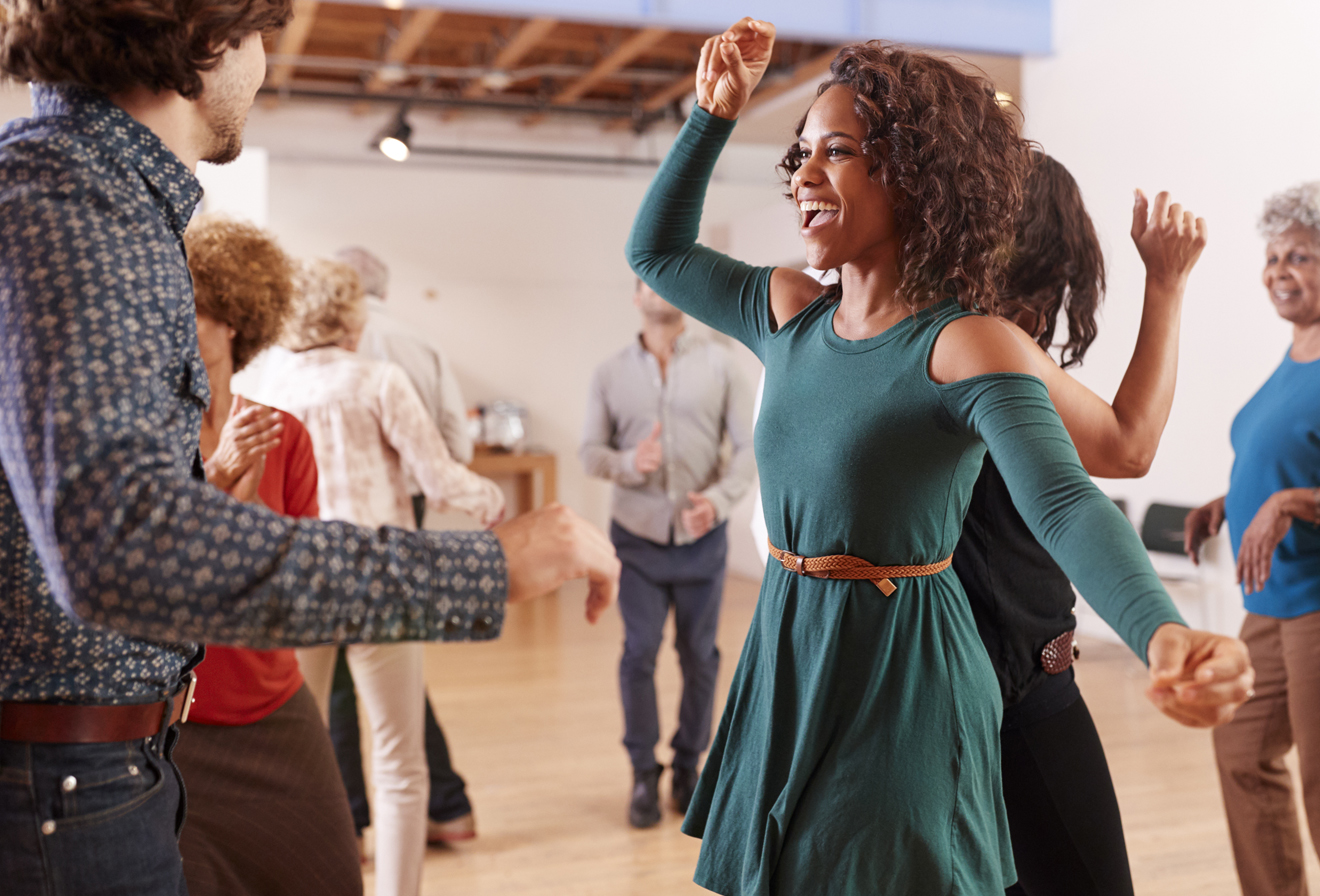 Singles taking dance lessons at Arthur Murray